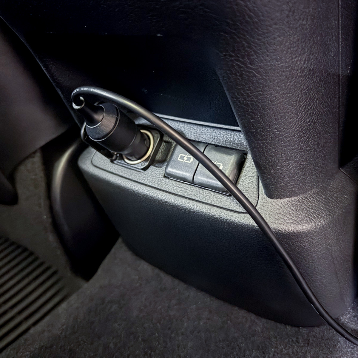 chestnut vehicle power adapter plugged into the car