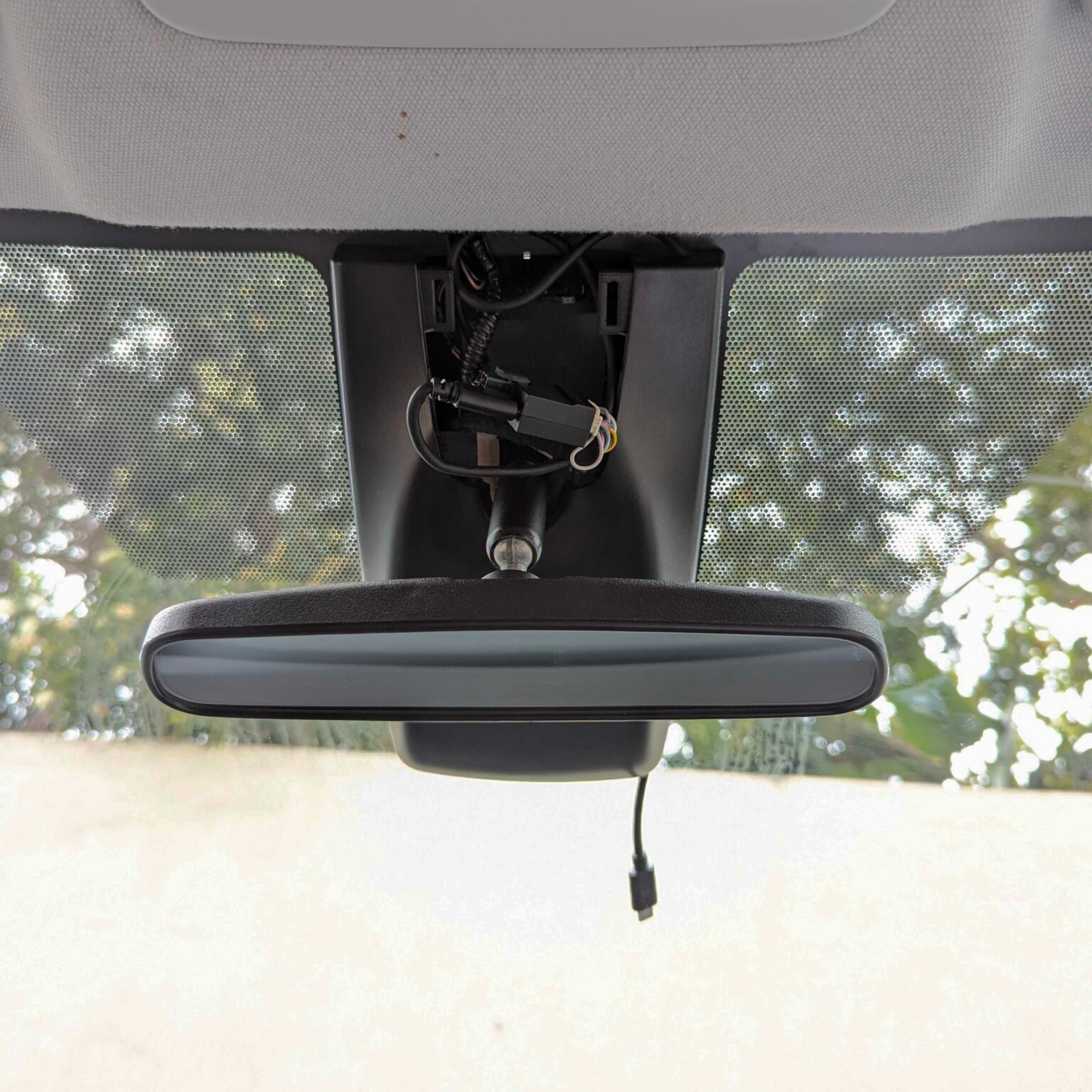 re-attach the rearview mirror cover trim